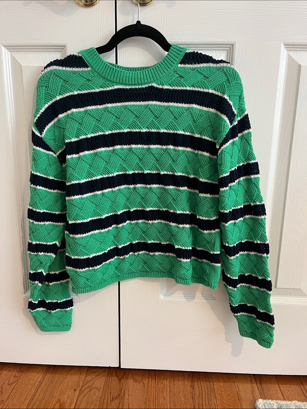 Green, navy, and white striped sweater with textured diamond pattern on front